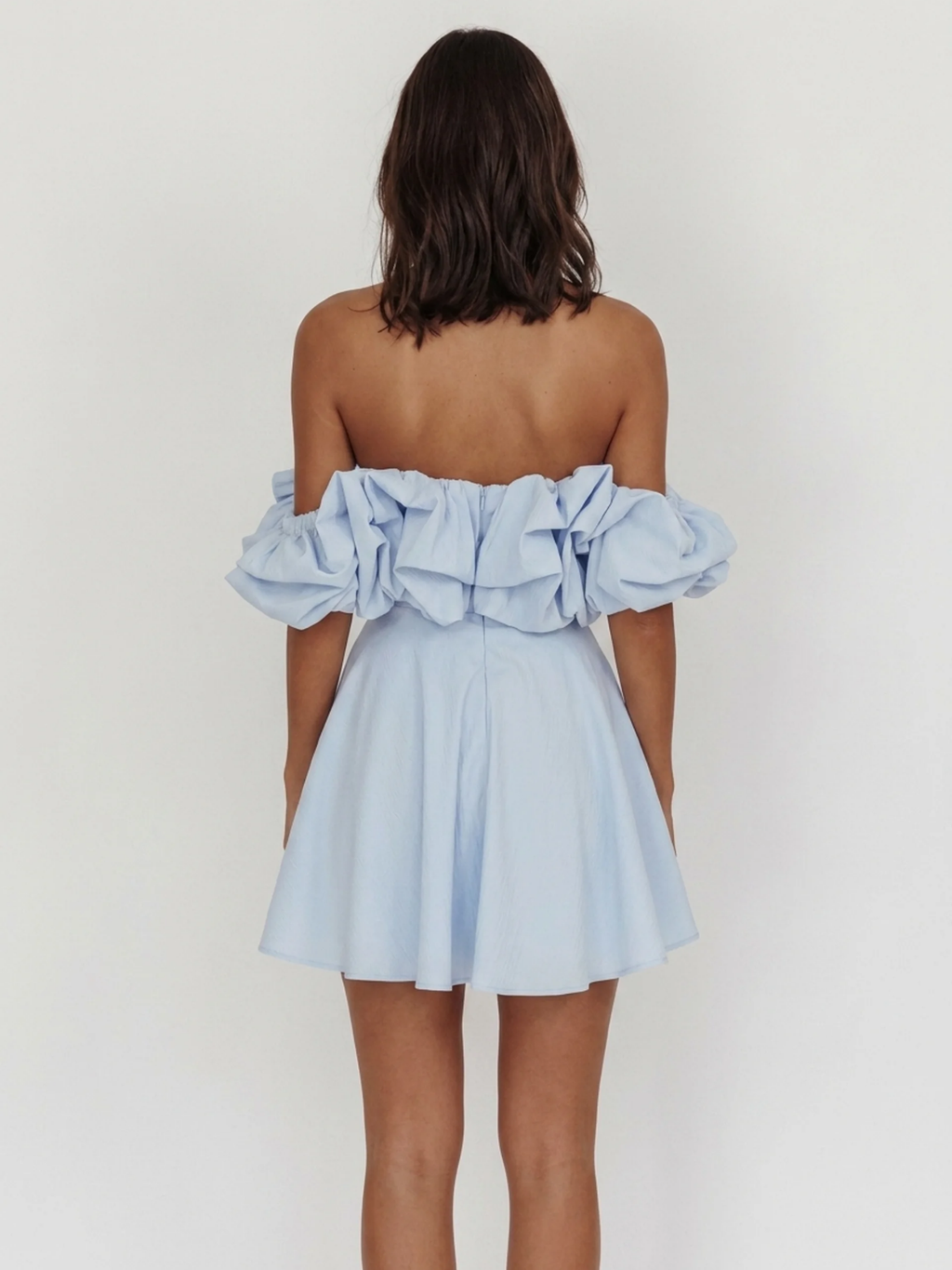 Calla off-shoulder ruffle mini dress in light blue — back view