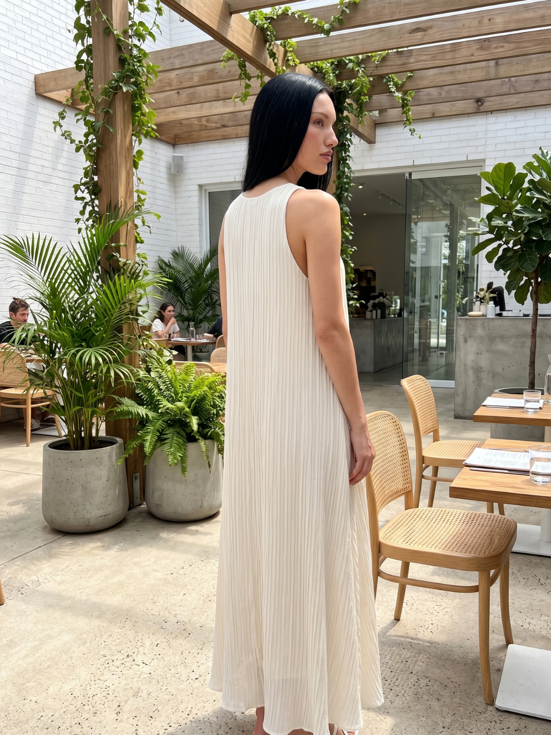 Nora sleeveless pleated maxi dress in White — detail view