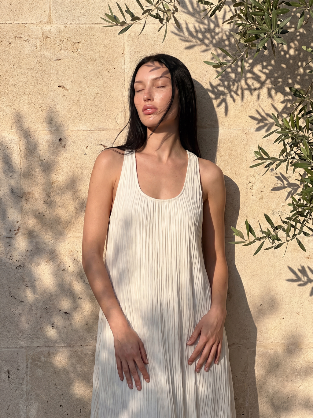 Nora sleeveless pleated maxi dress in White — full-length view