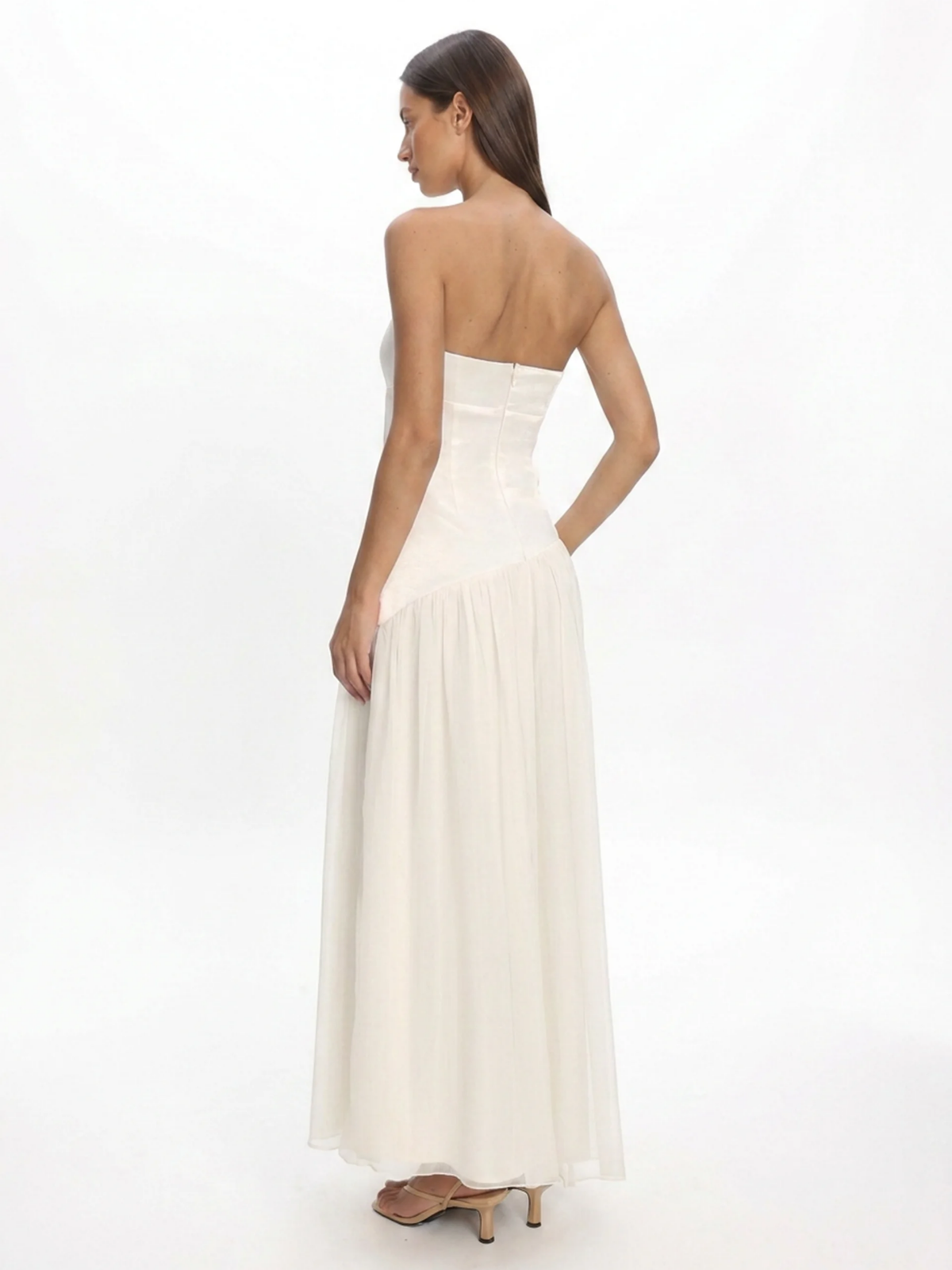 Arlo strapless asymmetric drop-waist maxi dress in white — back view