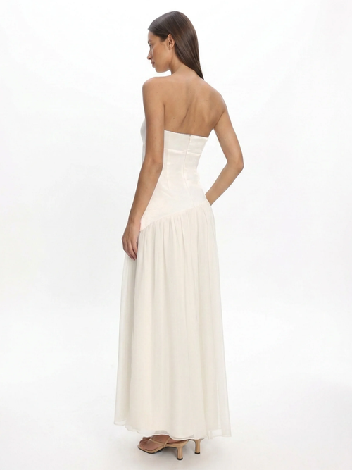 Arlo strapless asymmetric drop-waist maxi dress in white — back view