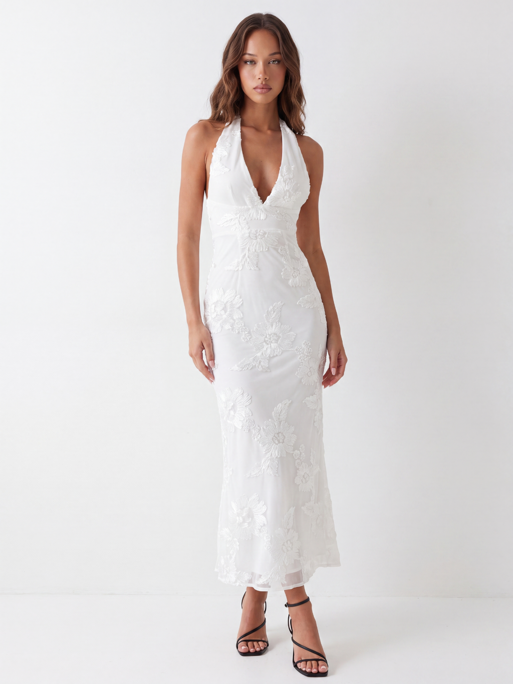 Capri backless halter maxi dress with floral embellishment in white — front view