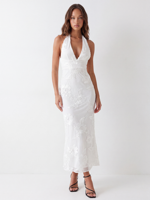 Capri backless halter maxi dress with floral embellishment in white — front view