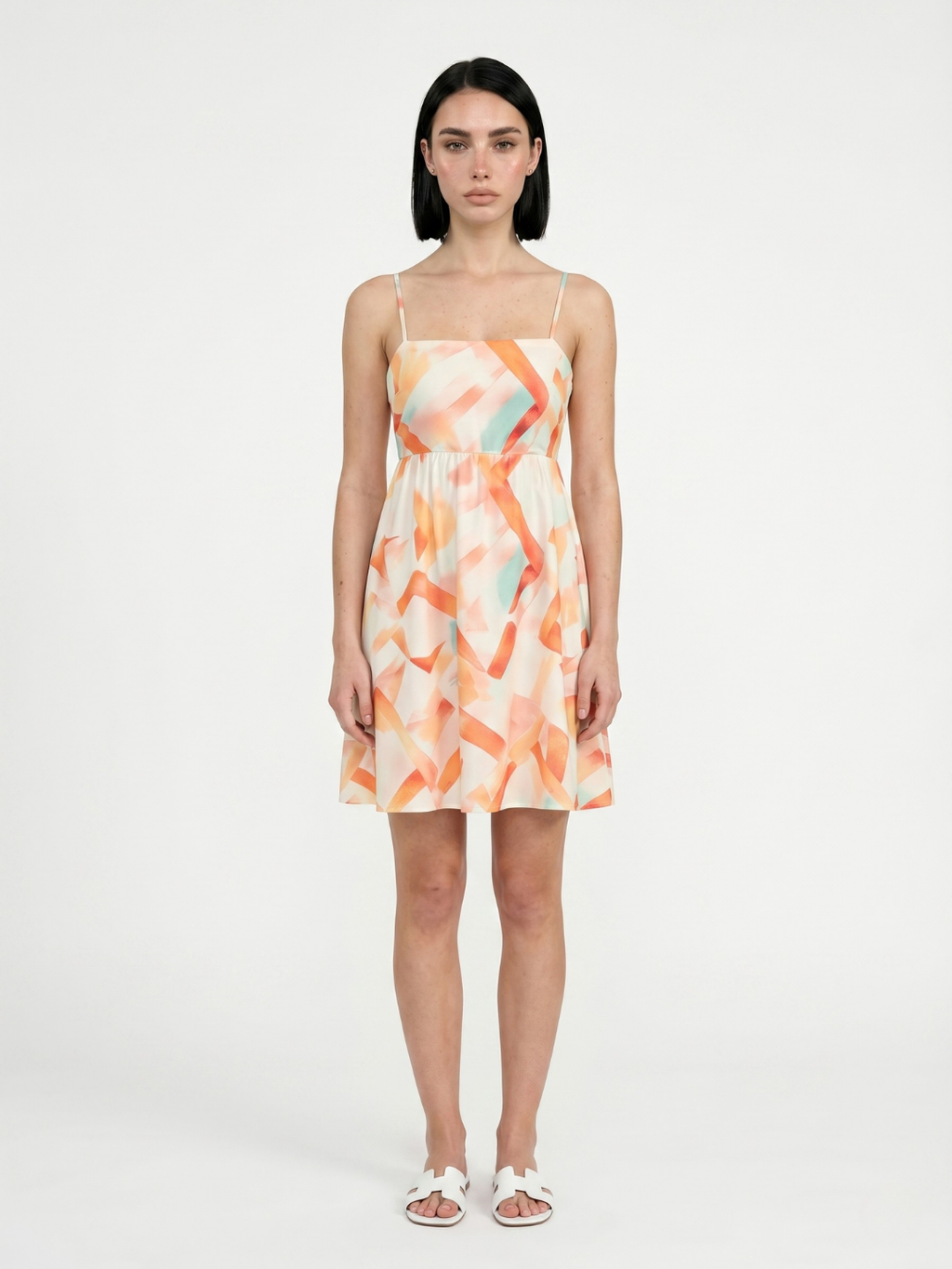 Luna square-neck mini dress in orange abstract print — front view
