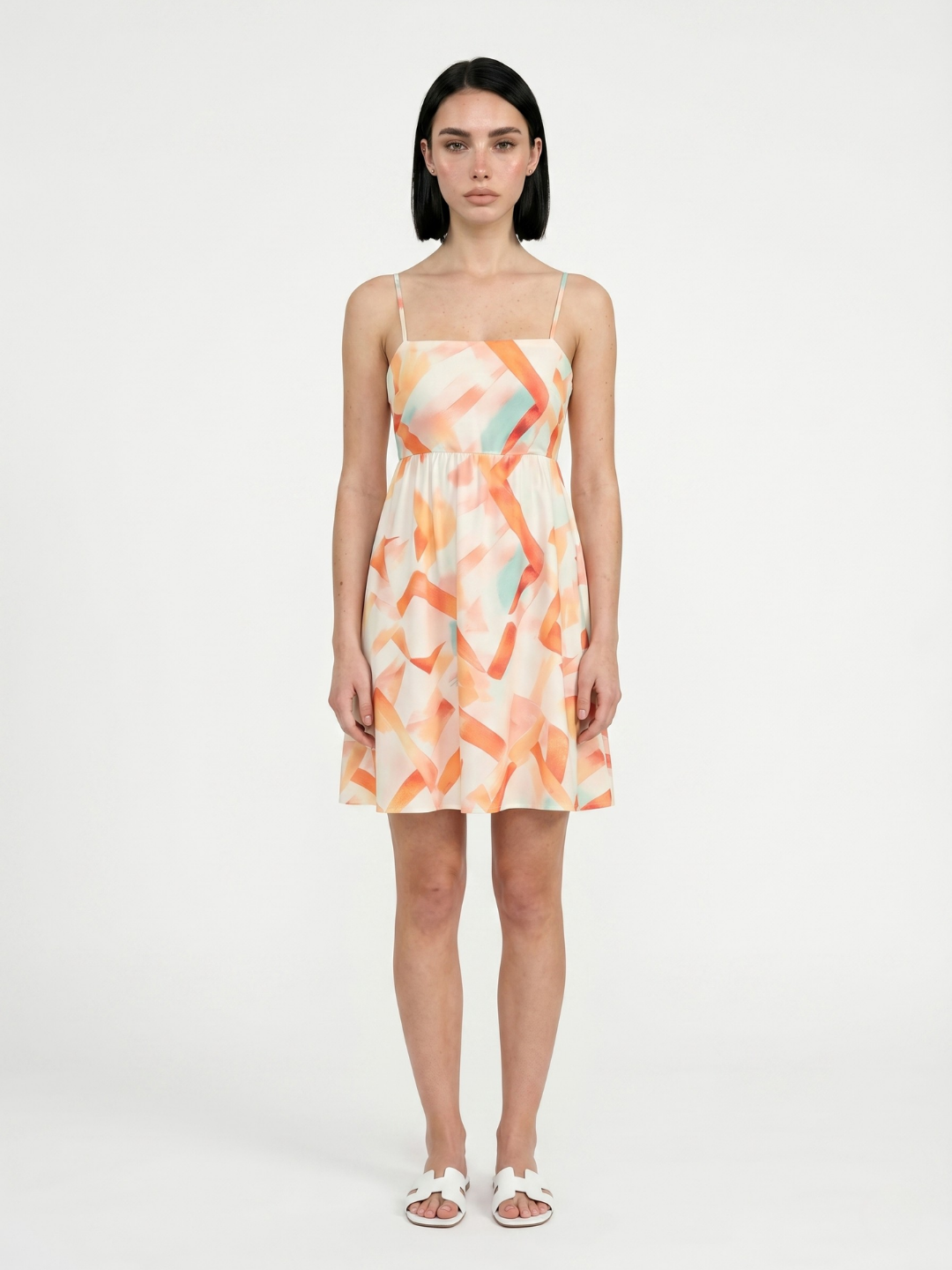 Luna square-neck mini dress in orange abstract print — front view