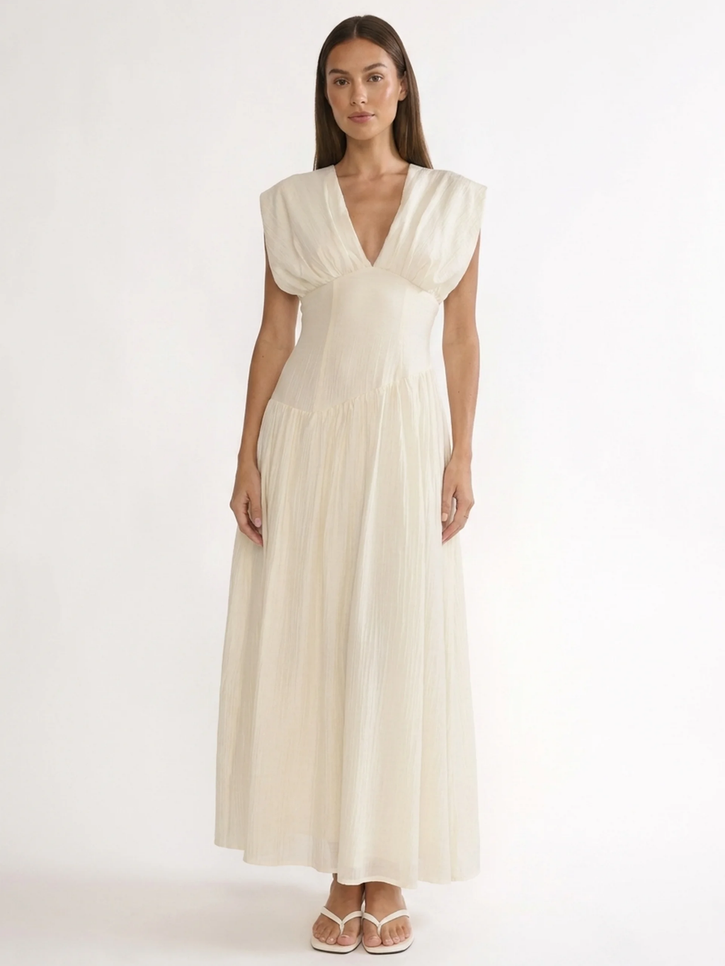 Hazel V-neck ruched maxi dress with asymmetric waist in white — front view