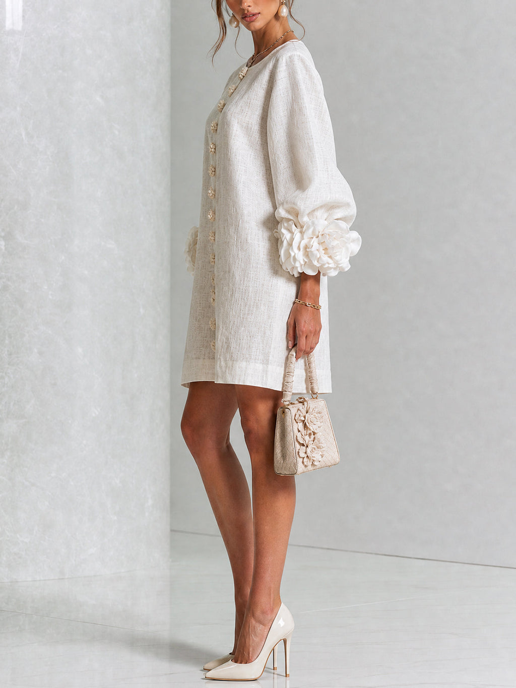 Ivory long sleeve mini dress with rosette cuffs and floral buttons - view 2
