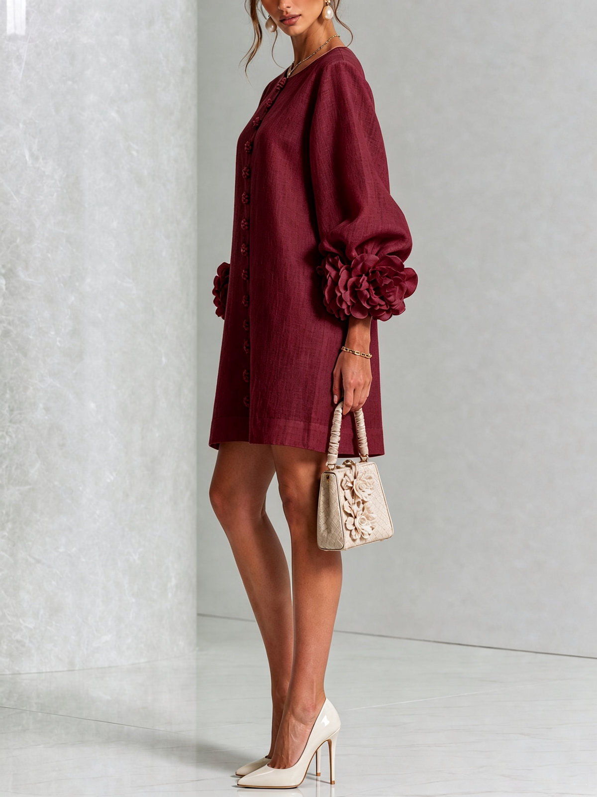 Ivory long sleeve mini dress with rosette cuffs and floral buttons - view 36