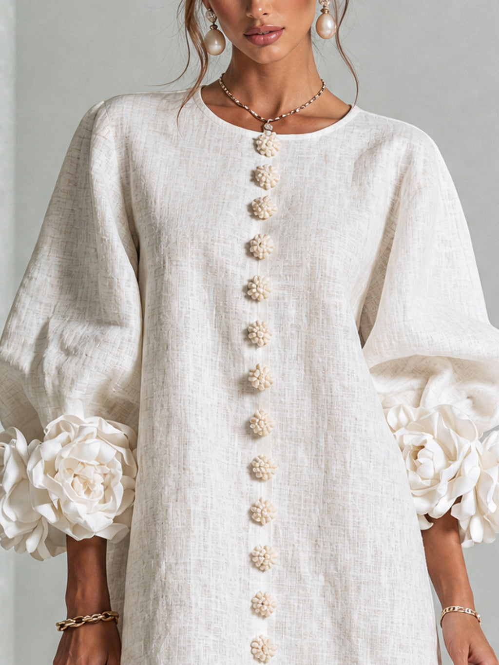 Ivory long sleeve mini dress with rosette cuffs and floral buttons - view 5