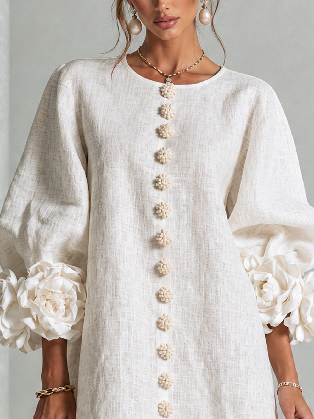 Ivory long sleeve mini dress with rosette cuffs and floral buttons - view 5