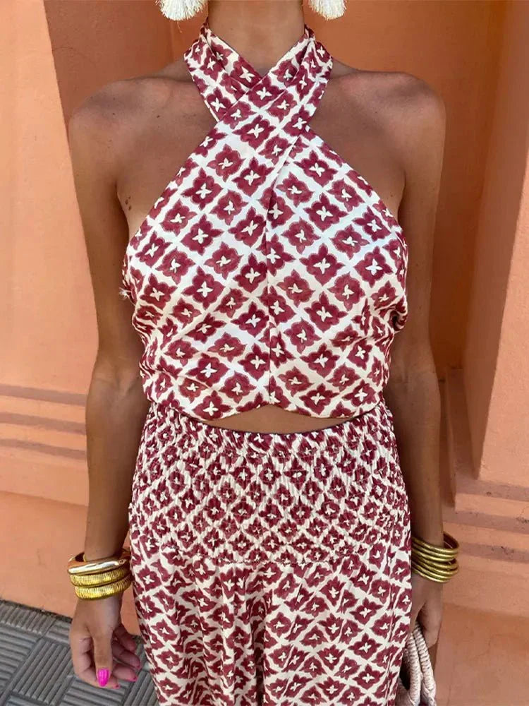 Woman wearing a red and cream geometric print halter crop top and matching maxi skirt set - view 2