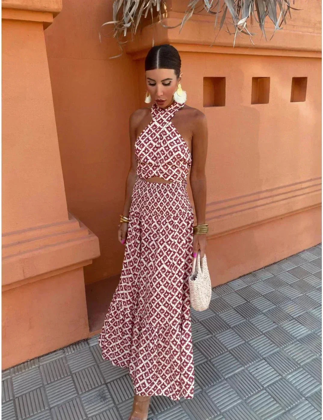 Woman wearing a red and cream geometric print halter crop top and matching maxi skirt set - view 5