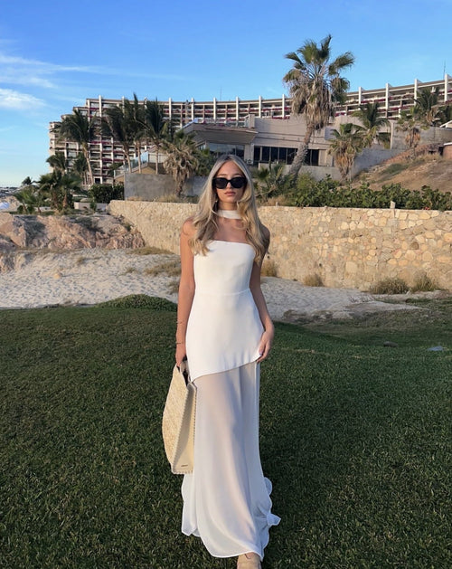 Strapless asymmetric maxi dress with sheer skirt and thigh slit