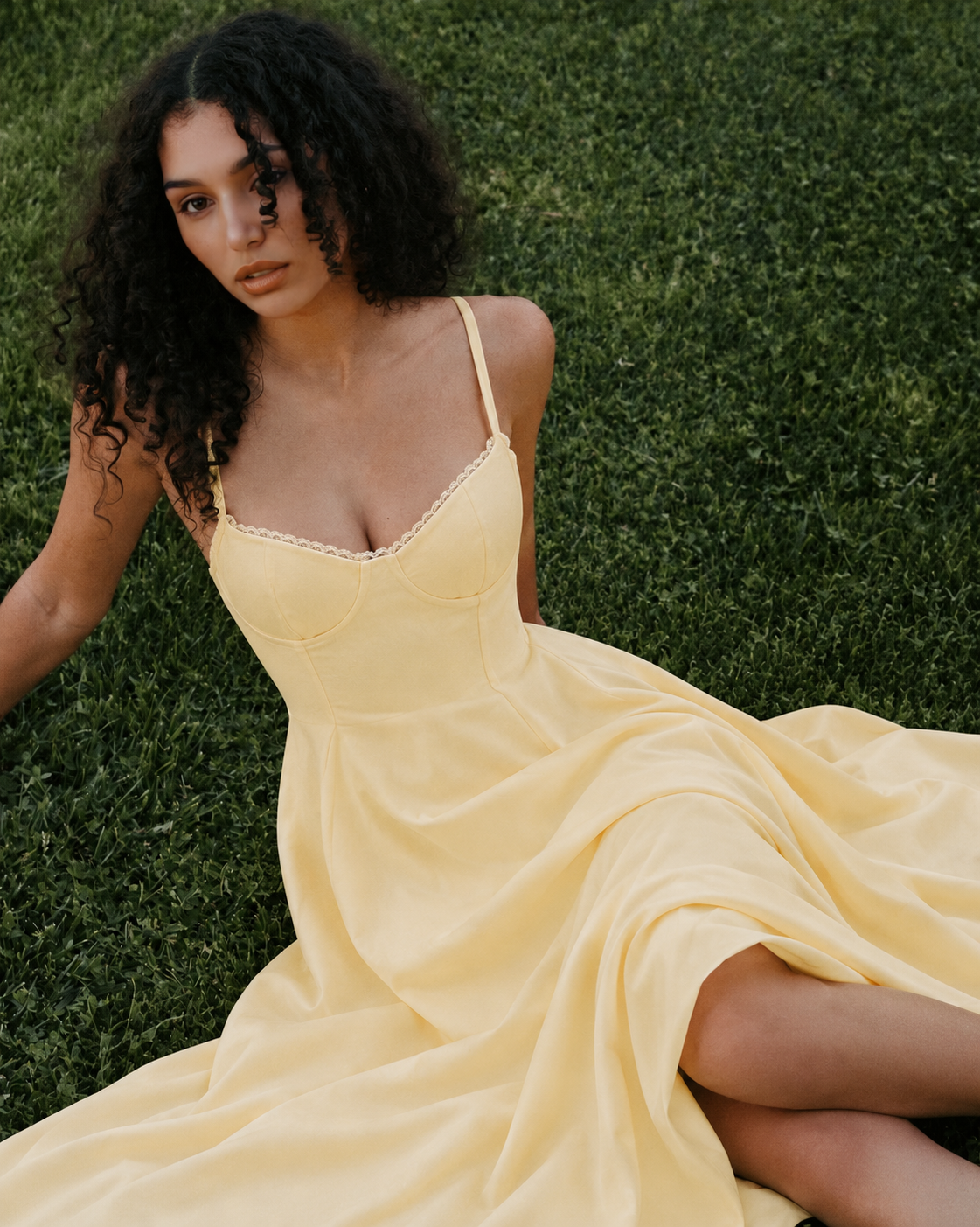Woman wearing a corset A line midi dress with lace-trimmed sweetheart neckline and full circle skirt