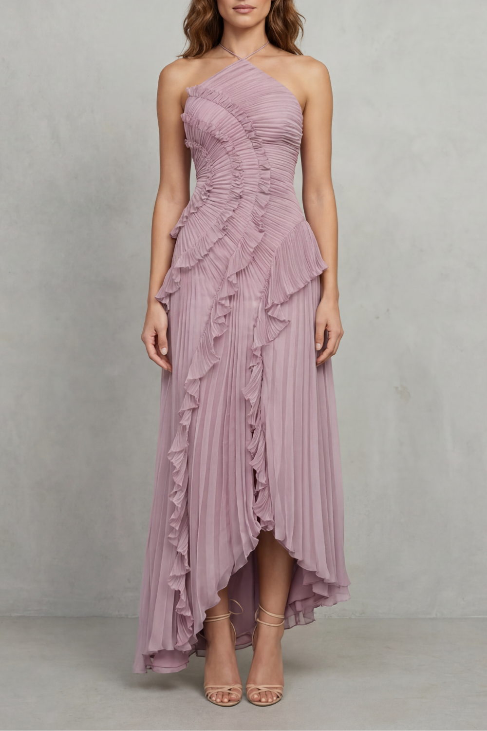 Pink pleated chiffon halter maxi dress with cascading ruffle detail and high-low hem