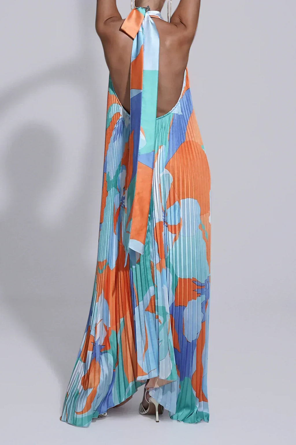 Pleated halter maxi dress in an orange and blue abstract print with keyhole neckline and open back - view 2