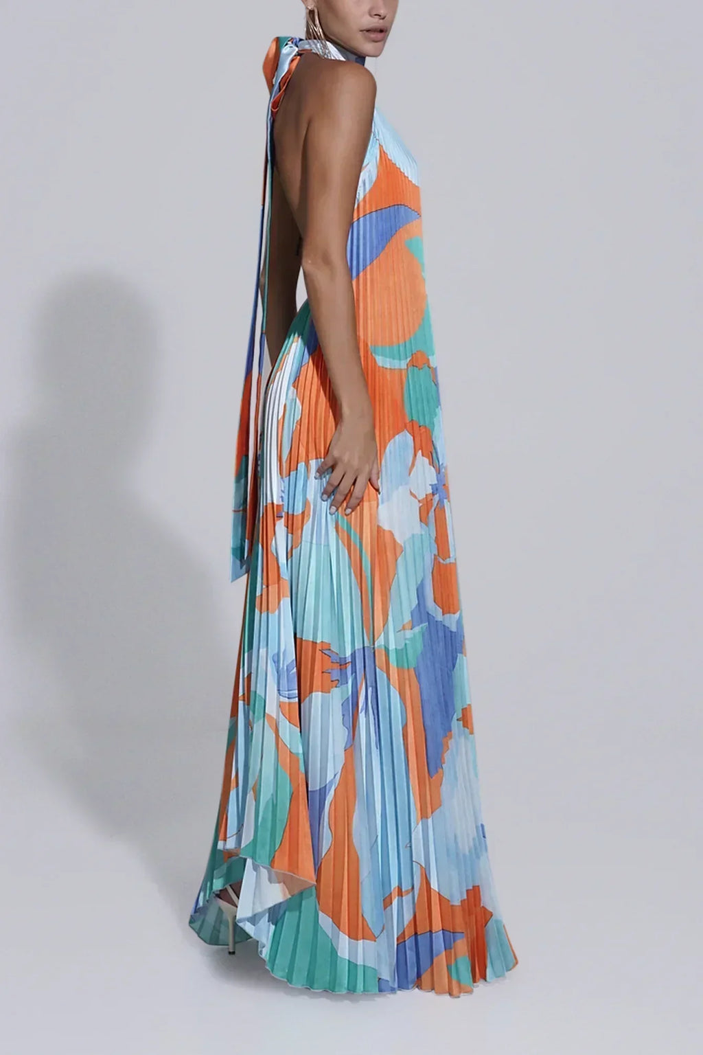 Pleated halter maxi dress in an orange and blue abstract print with keyhole neckline and open back - view 3