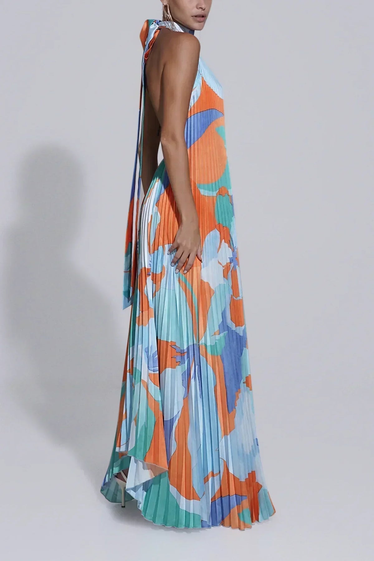 Pleated halter maxi dress in an orange and blue abstract print with keyhole neckline and open back - view 3