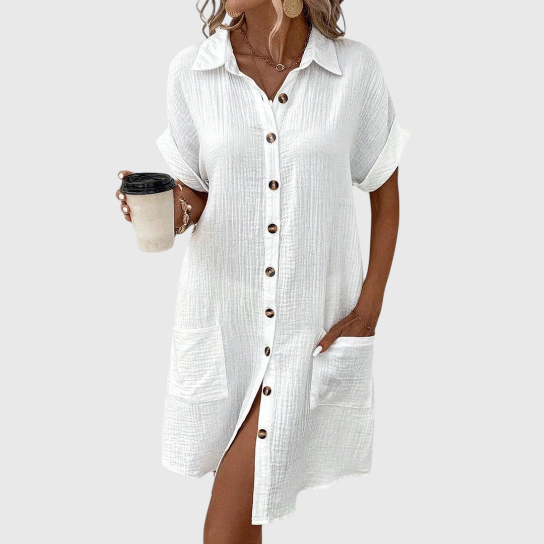 Woman wearing a crinkle-textured button-up shirt dress with collar, cuffed short sleeves and front patch pockets - view 6