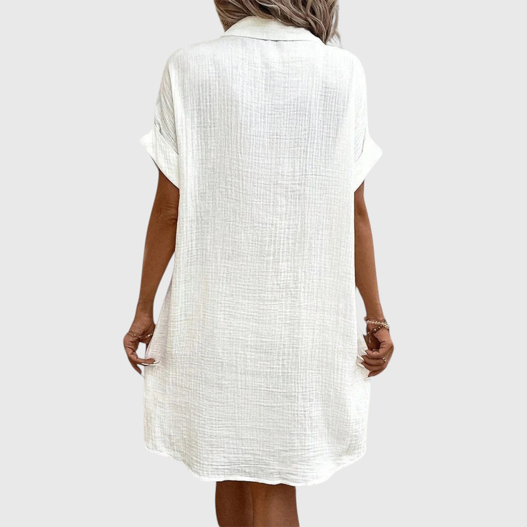 Woman wearing a crinkle-textured button-up shirt dress with collar, cuffed short sleeves and front patch pockets - view 7