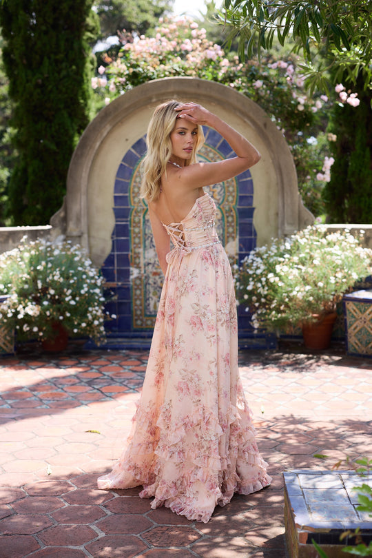 Woman wearing a floral corset maxi dress with a beaded halter neckline and a ruffle hem - view 6