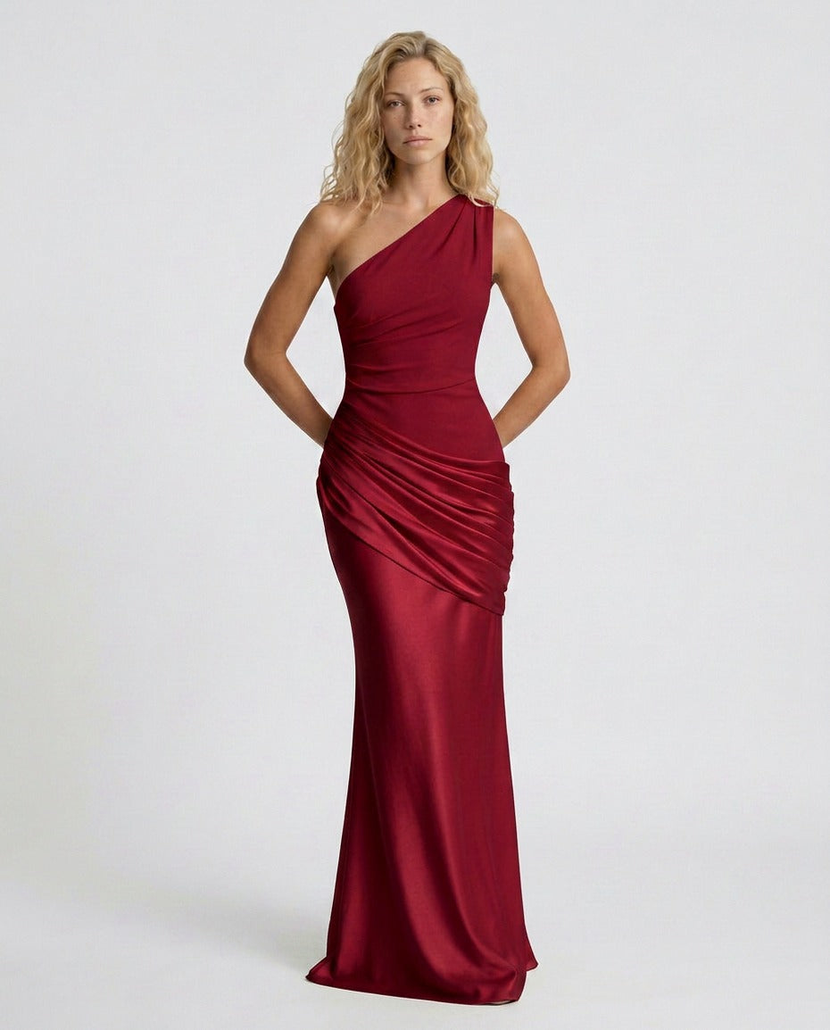 Woman wearing a one shoulder satin formal maxi dress with ruched bodice and draped hip panel - view 16