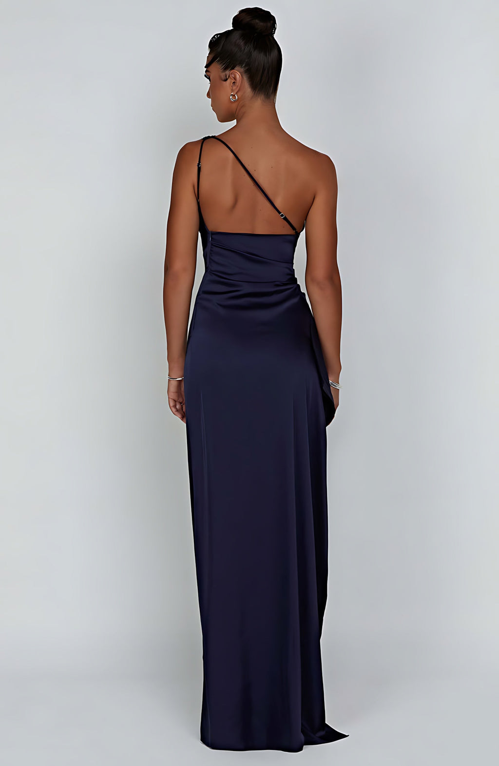 Woman wearing a one shoulder satin formal maxi dress with ruched waist and high thigh split - view 21