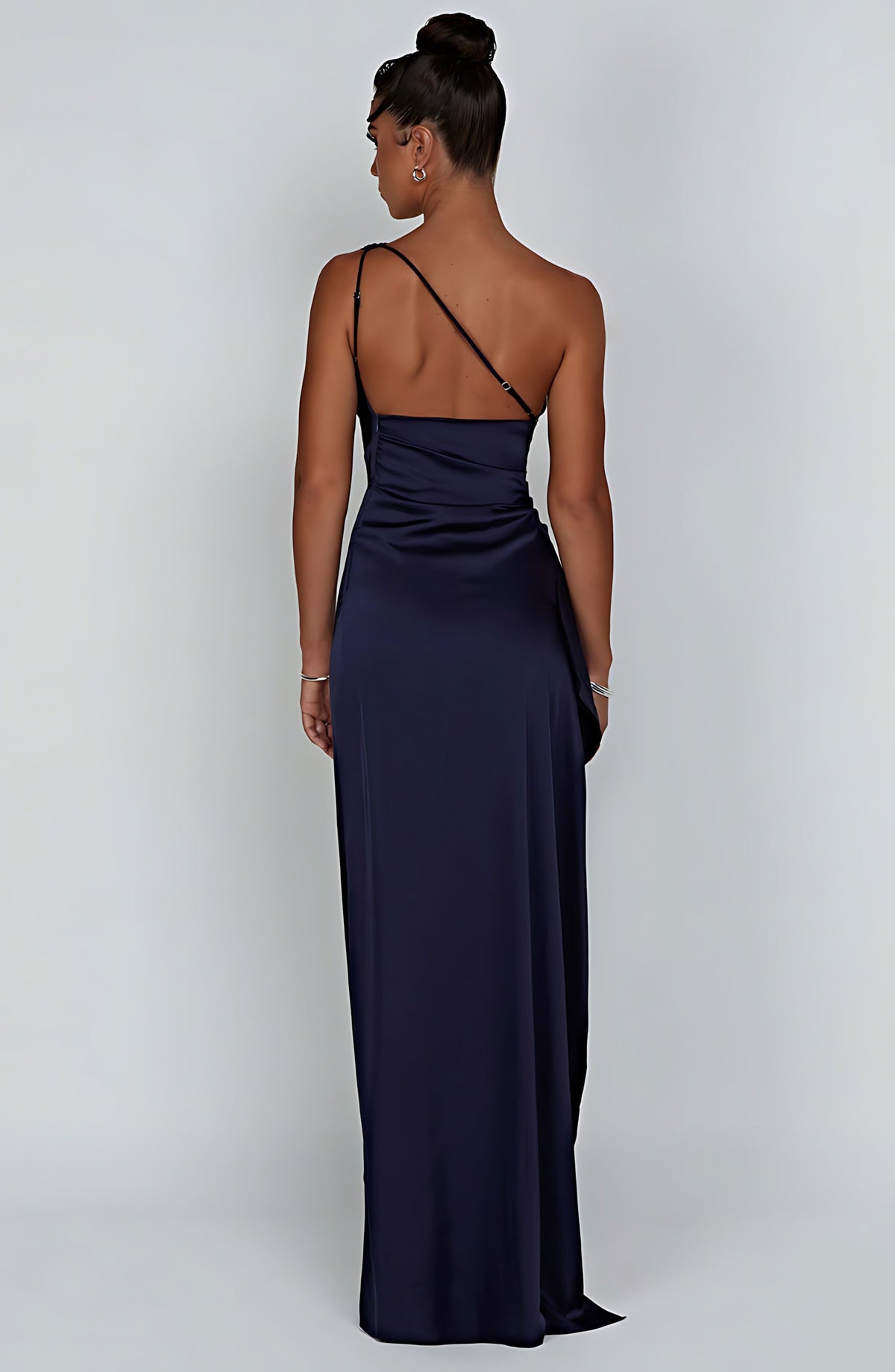 Woman wearing a one shoulder satin formal maxi dress with ruched waist and high thigh split - view 21