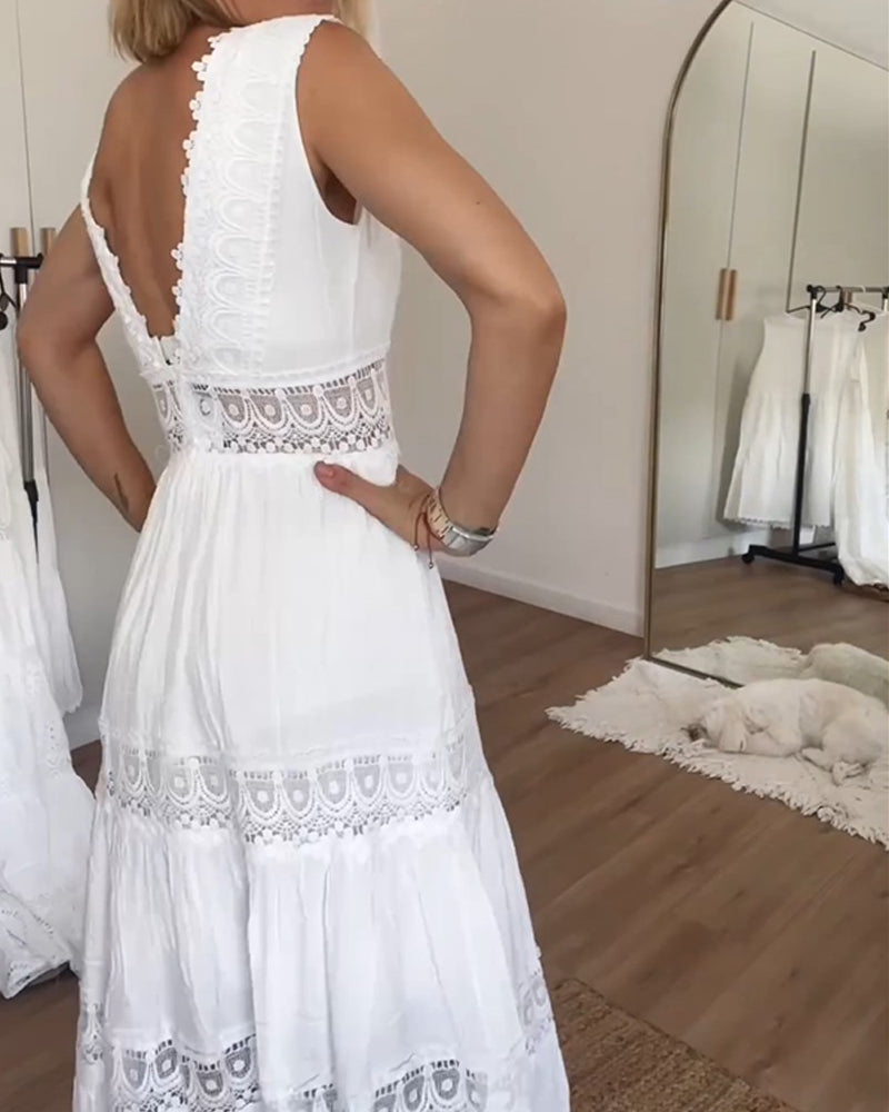 Woman wearing a white sleeveless tiered lace midi dress with a V-neck and open back - view 2
