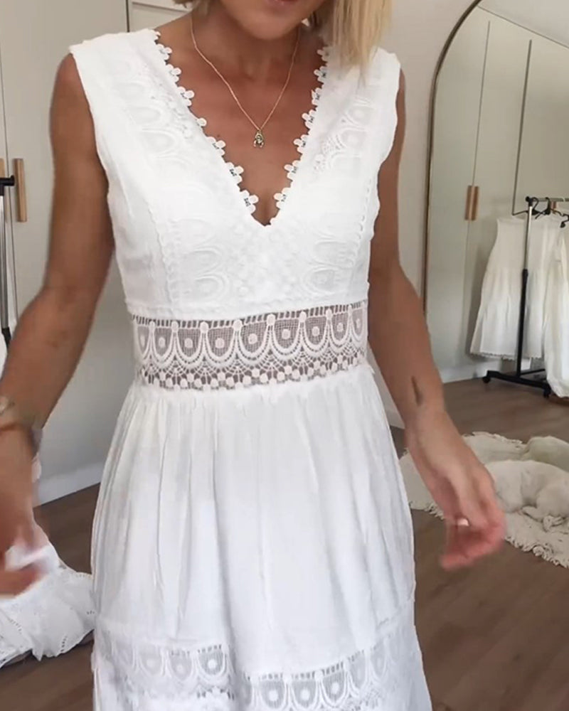 Woman wearing a white sleeveless tiered lace midi dress with a V-neck and open back - view 3