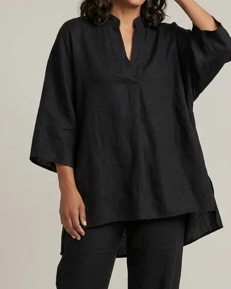 Woman in a black batwing V-neck tunic and cuffed pants matching set - view 4