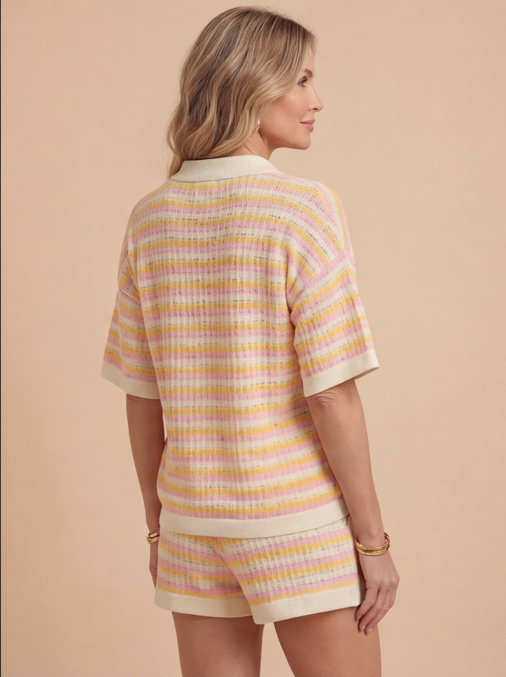 Woman wearing a striped knit two piece set with a polo collar top and matching shorts - view 2