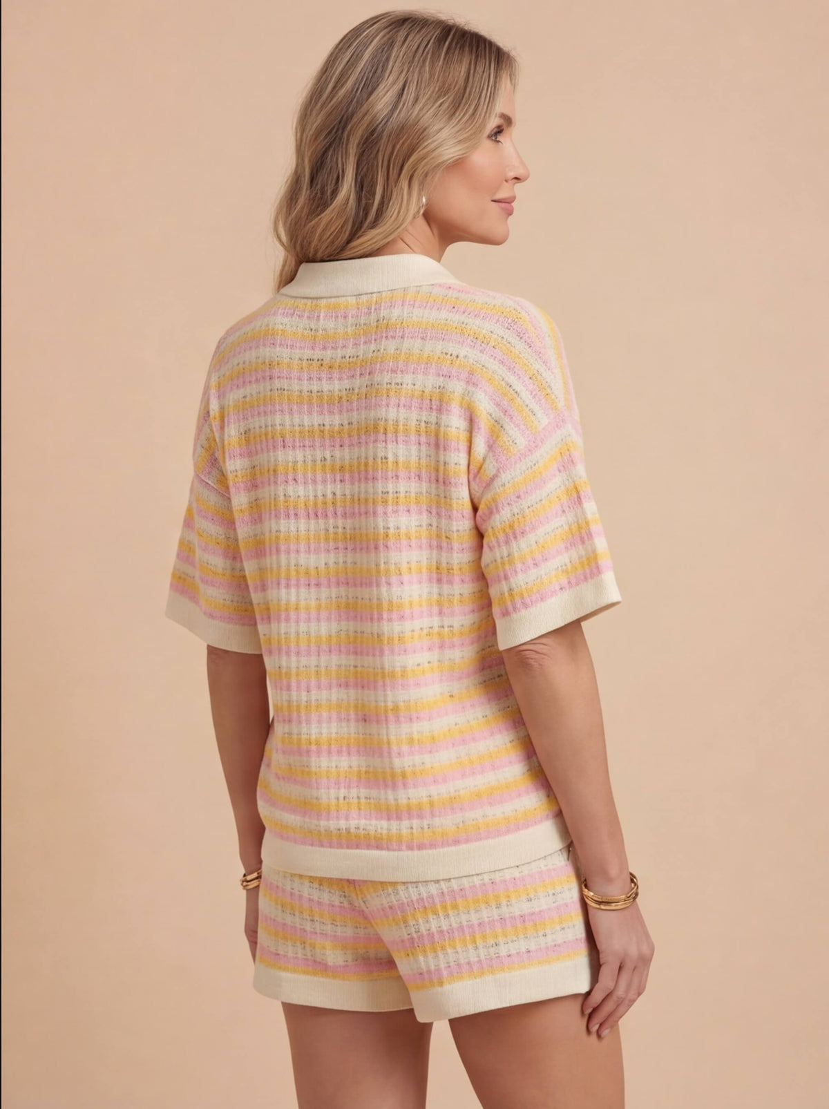 Woman wearing a striped knit two piece set with a polo collar top and matching shorts - view 2