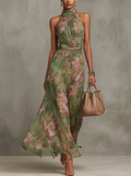 Sage green floral halter maxi dress with ruched waist and flowing full-length skirt