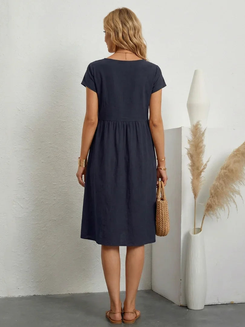 Lillian crew-neck gathered knee-length dress with pockets — back view