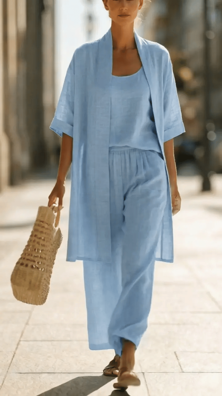 Woman wearing a three piece linen set with open duster, singlet and straight-leg pants - view 4