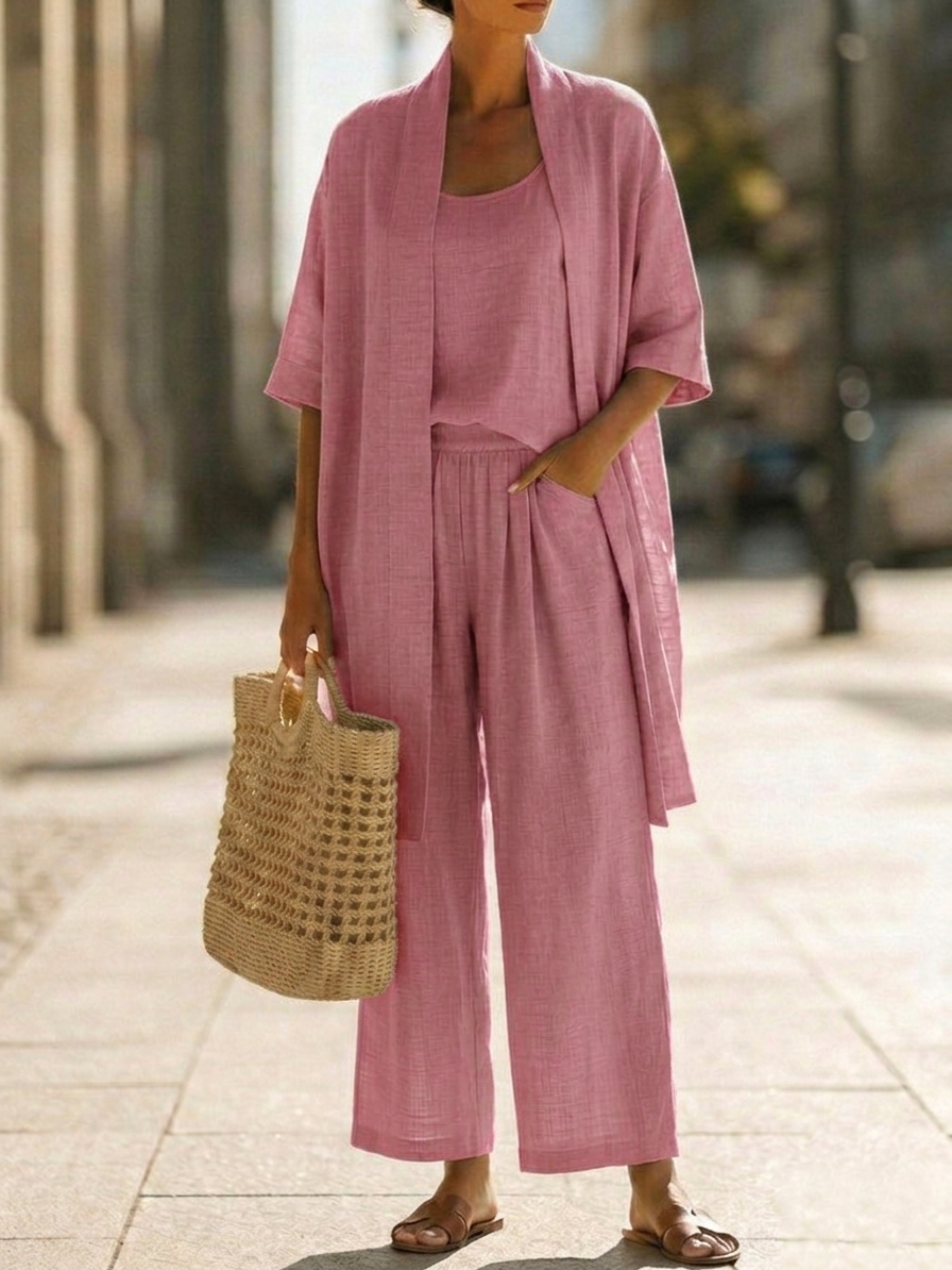 Woman wearing a three piece linen set with open duster, singlet and straight-leg pants - view 6