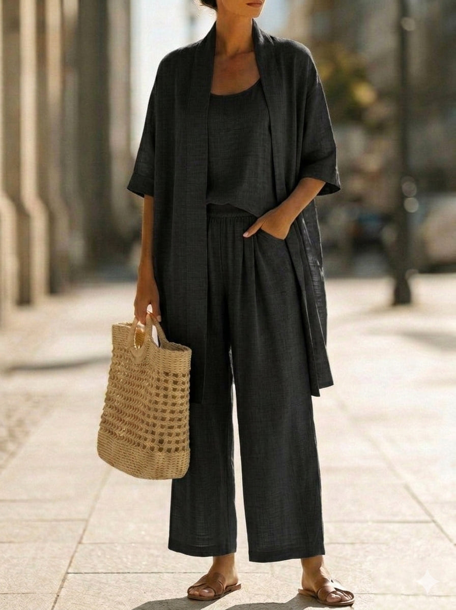 Woman wearing a three piece linen set with open duster, singlet and straight-leg pants - view 8