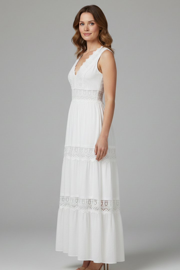 Woman wearing a white sleeveless lace maxi dress with V-neck and tiered skirt - view 3