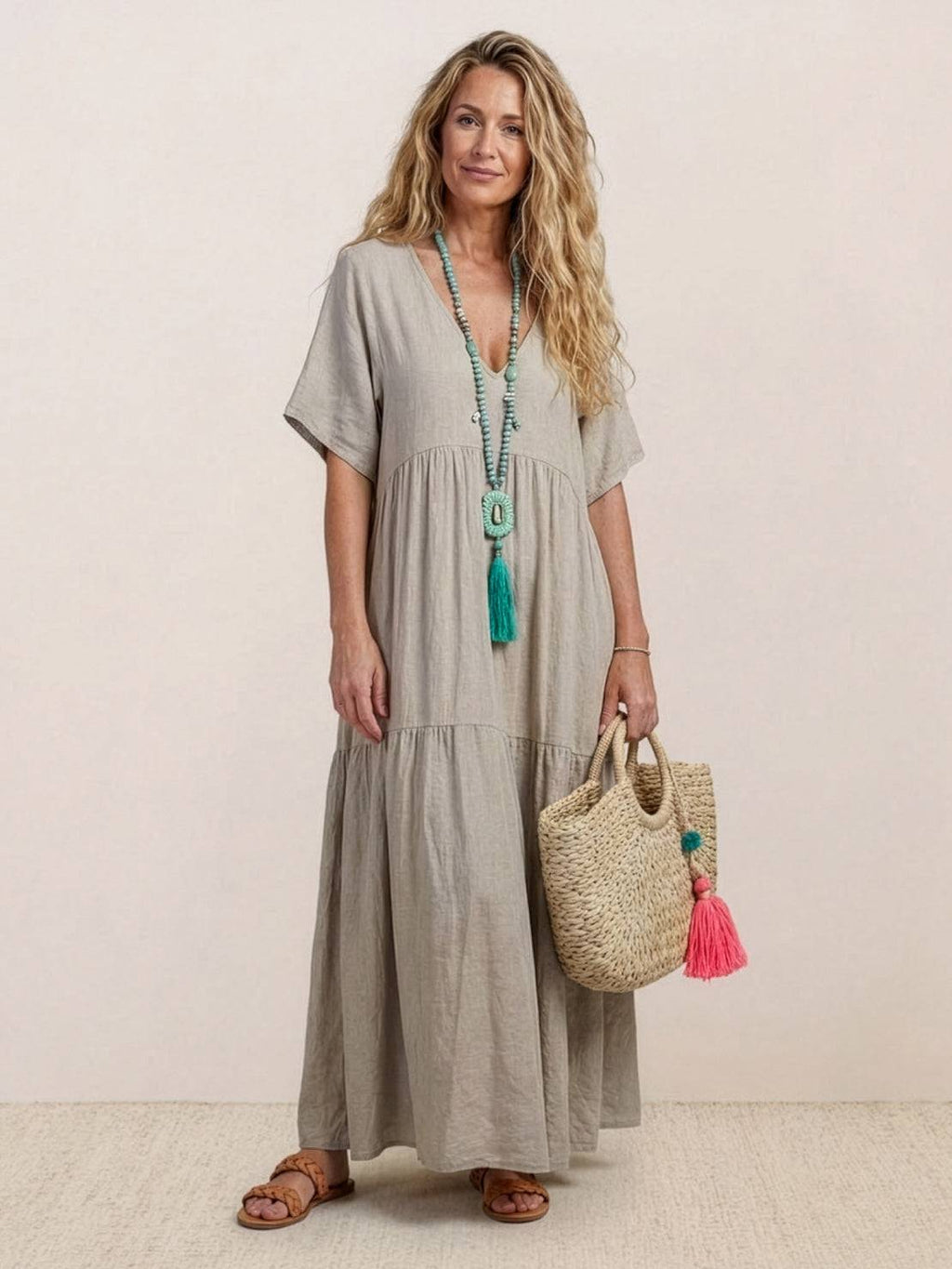 Woman wearing a V-neck tiered maxi dress with short sleeves - view 10