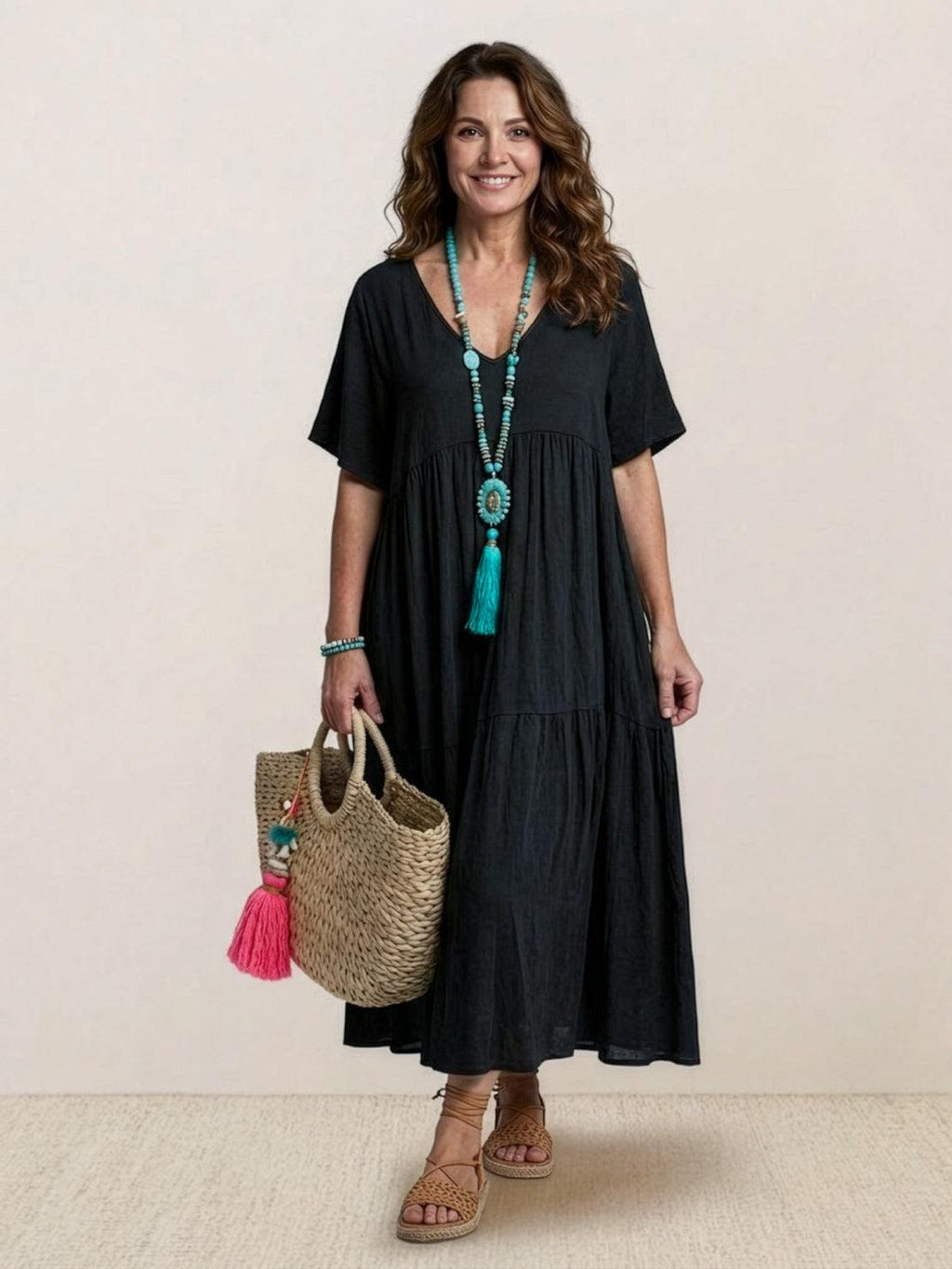 Woman wearing a V-neck tiered maxi dress with short sleeves - view 11