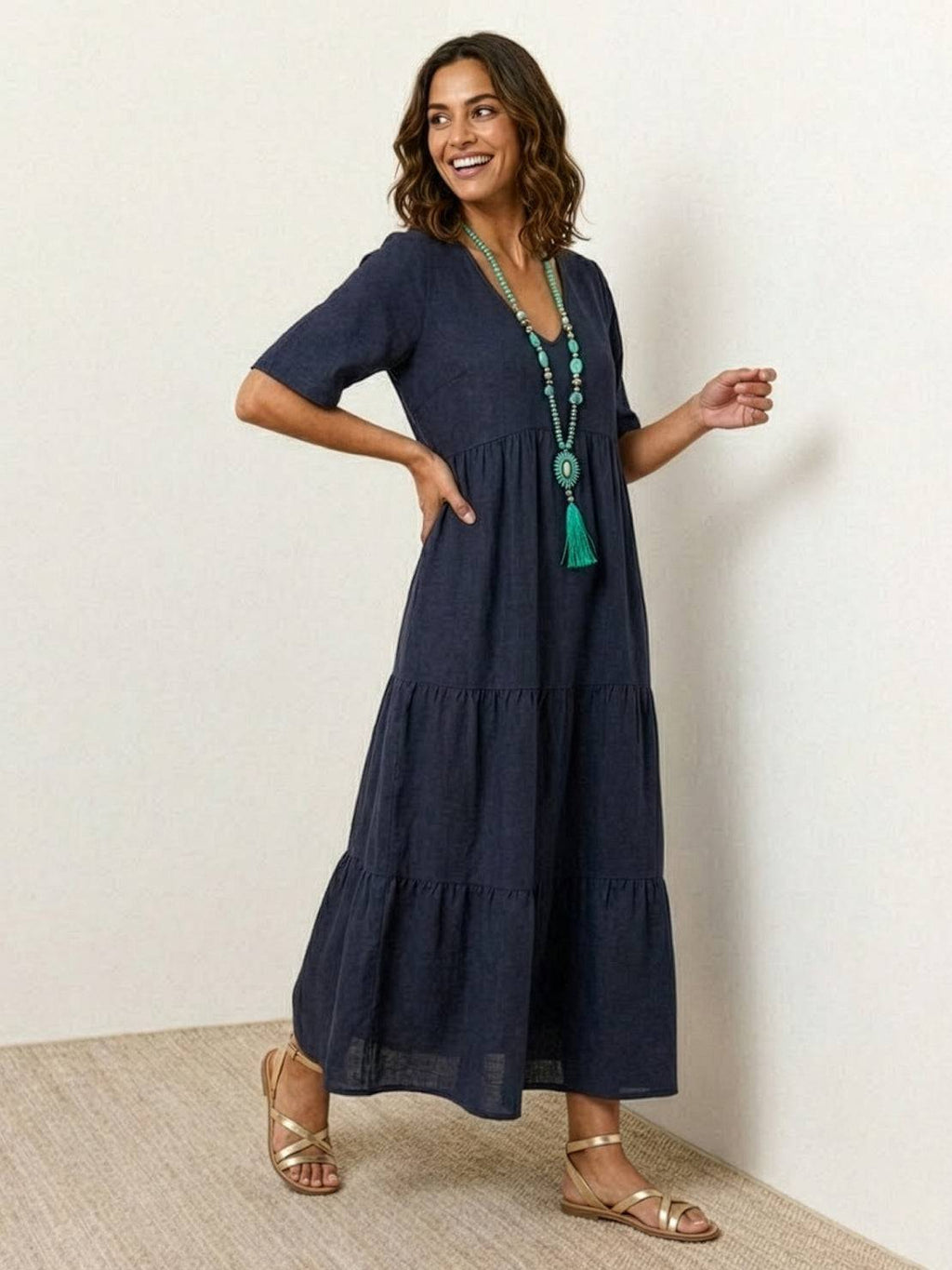 Woman wearing a V-neck tiered maxi dress with short sleeves - view 12