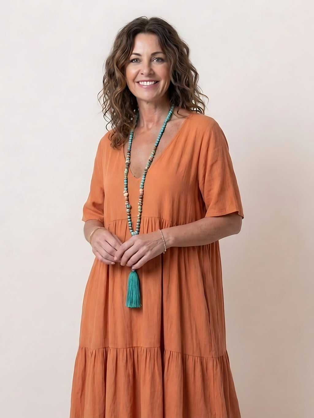 Woman wearing a V-neck tiered maxi dress with short sleeves - view 13