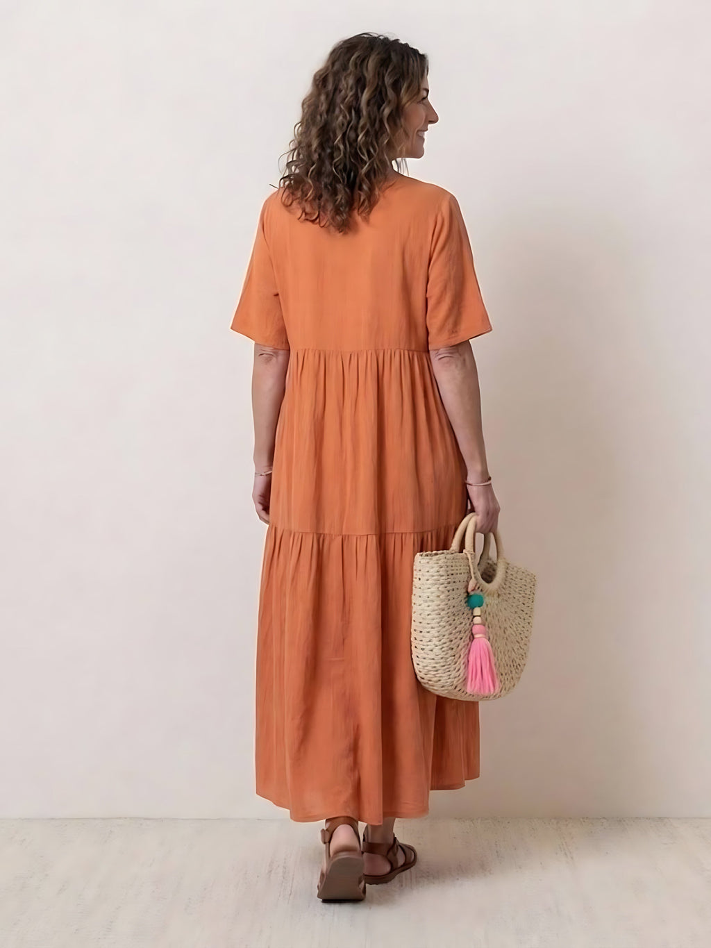 Woman wearing a V-neck tiered maxi dress with short sleeves - view 14