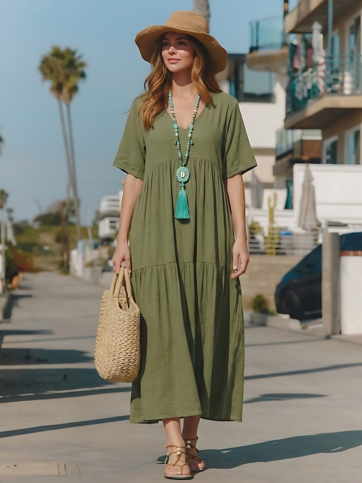 Woman wearing a V-neck tiered maxi dress with short sleeves - view 15