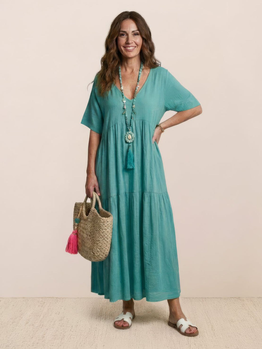 Woman wearing a V-neck tiered maxi dress with short sleeves - view 17