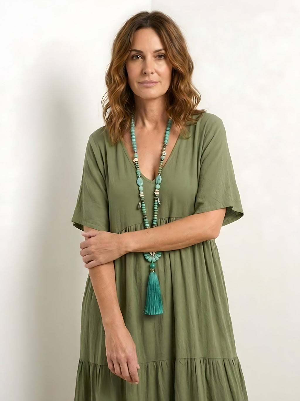 Woman wearing a V-neck tiered maxi dress with short sleeves - view 18