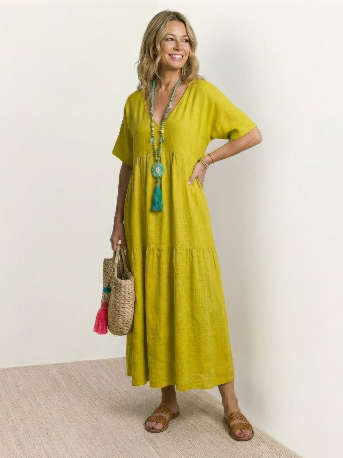 Woman wearing a V-neck tiered maxi dress with short sleeves - view 19