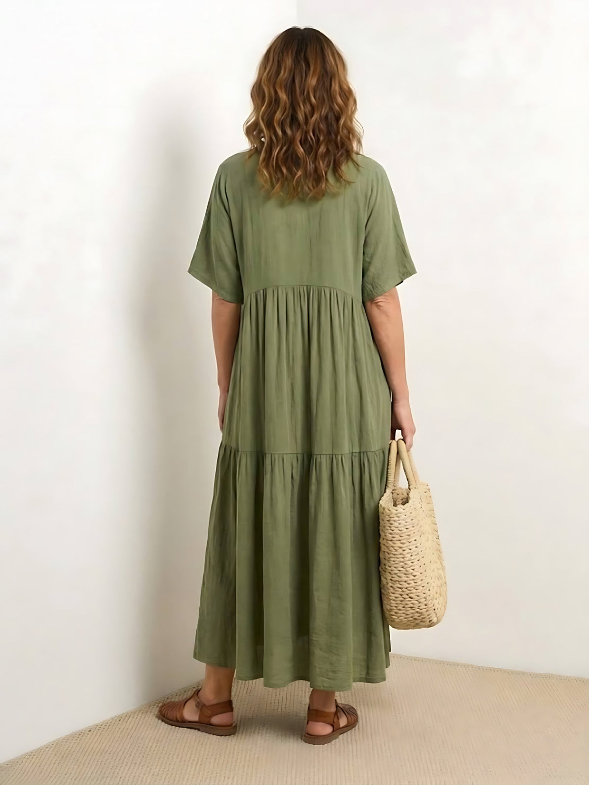 Woman wearing a V-neck tiered maxi dress with short sleeves - view 26