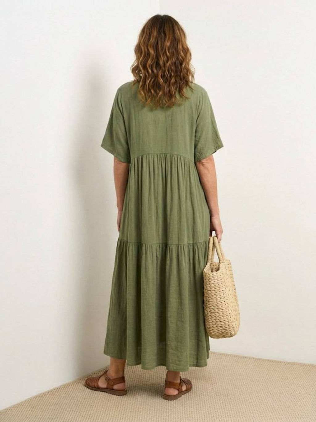 Woman wearing a V-neck tiered maxi dress with short sleeves - view 27